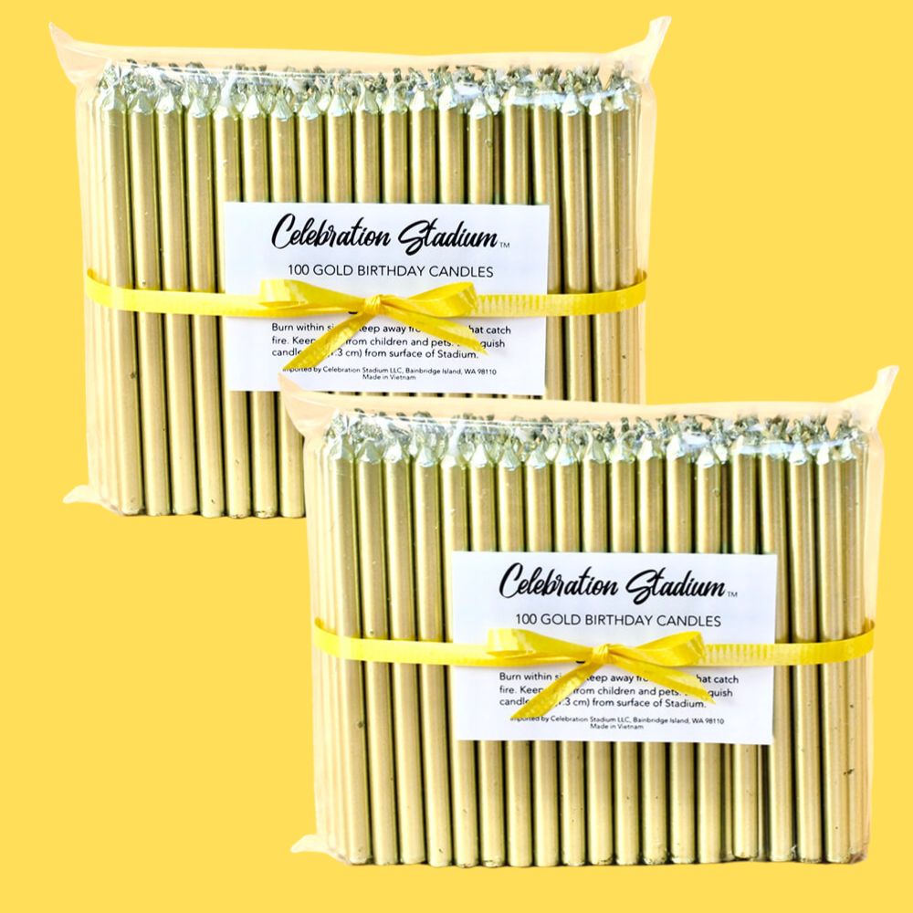 Two packs of 100 tall gold birthday candles