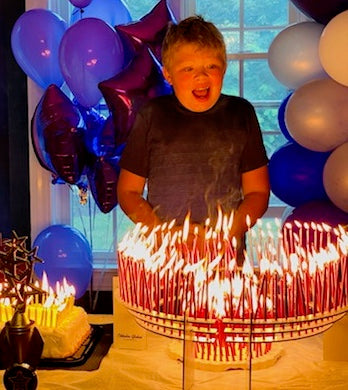 13 year-old Aidan celebrates with 350 candles, each one a donation towards finding a cure for Hunter Syndrome.  Aidan is battling this rare disease supported by a dedicated group of family and friends.