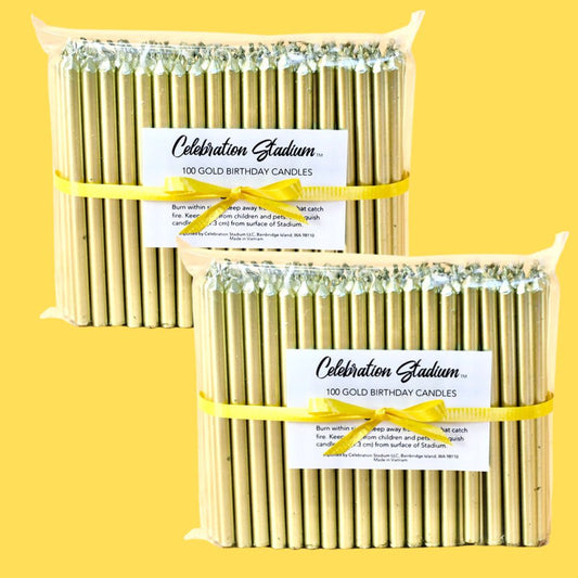 Two packs of 100 tall gold birthday candles 