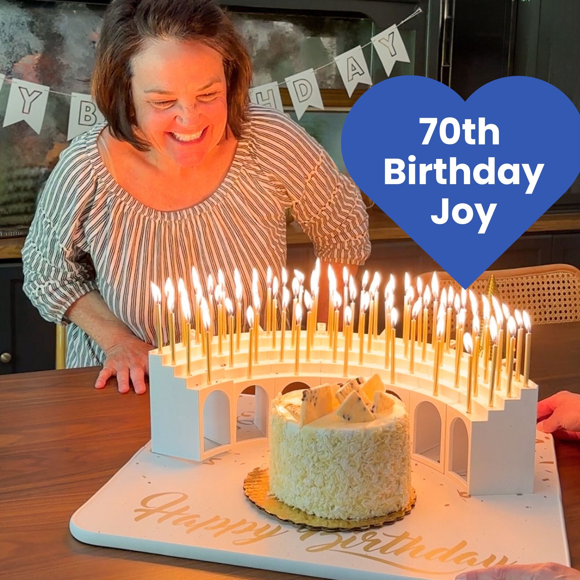 Birthday joy with 70 lit candles carried in  on a Grand Entrance Tray and a Celebration Stadium Grandstand Candle Holder.  This is the way to celebrate with a candle for every year.  And no messy wax drips on your cake.