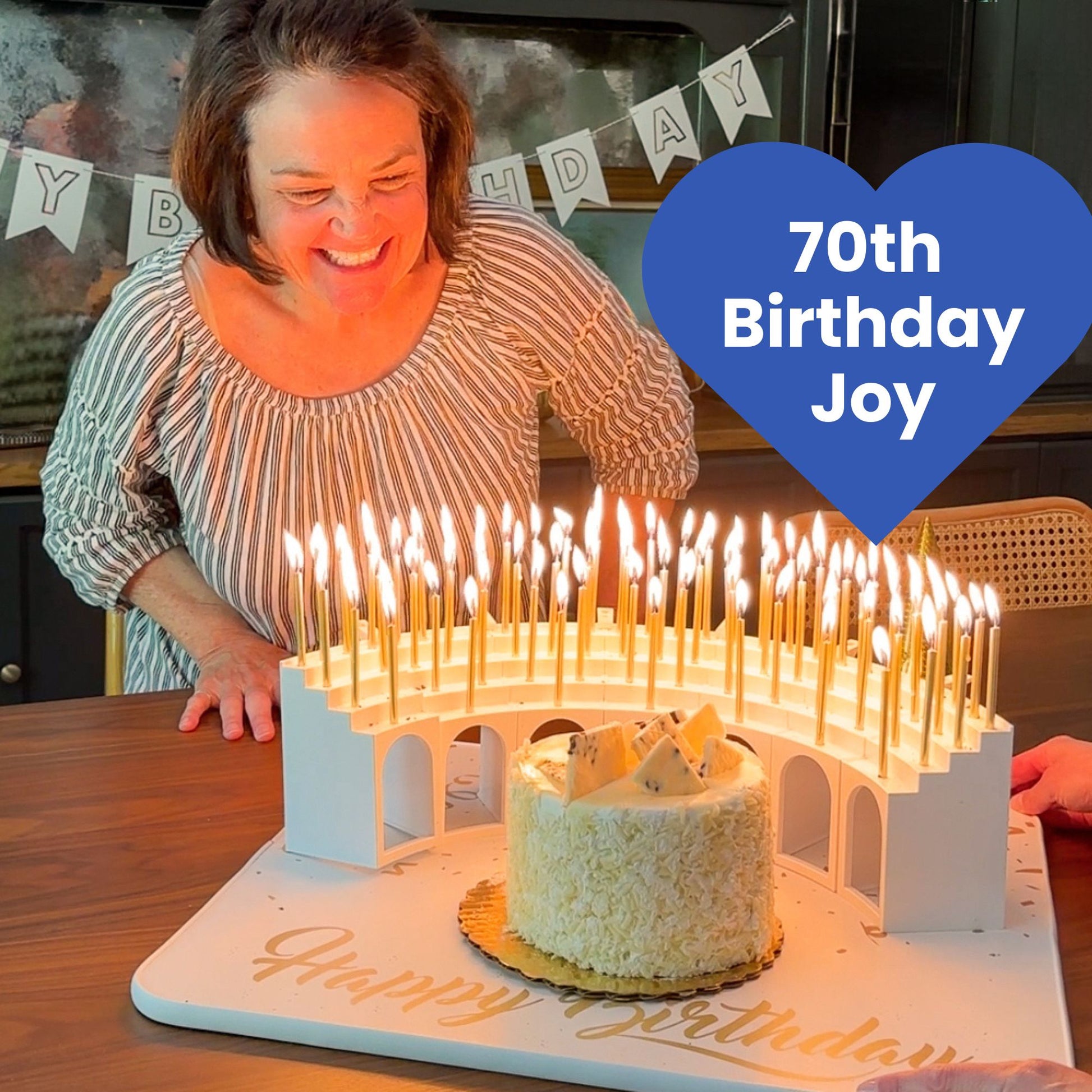 Birthday joy with 70 lit candles carried in  on a Grand Entrance Tray and a Celebration Stadium Grandstand Candle Holder.  This is the way to celebrate with a candle for every year.  And no messy wax drips on your cake.