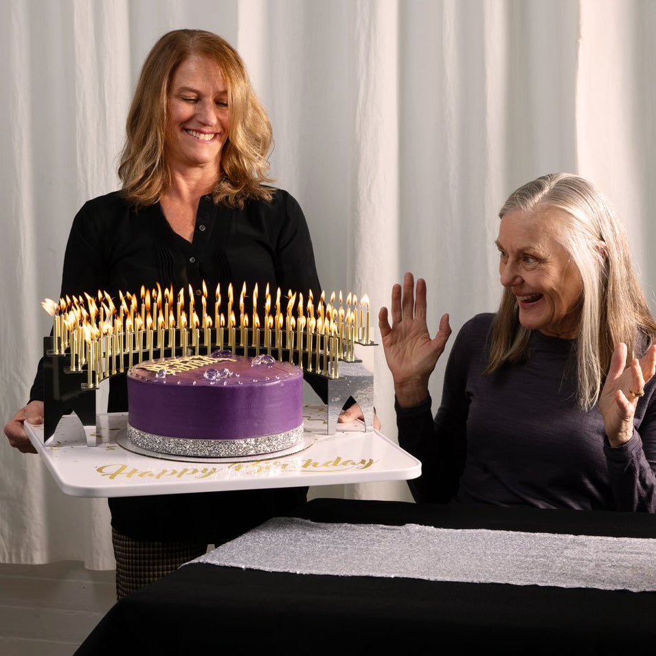 Carrying the Candelabra and birthday cake with 100 lit candles on a Grand Entrance Tray