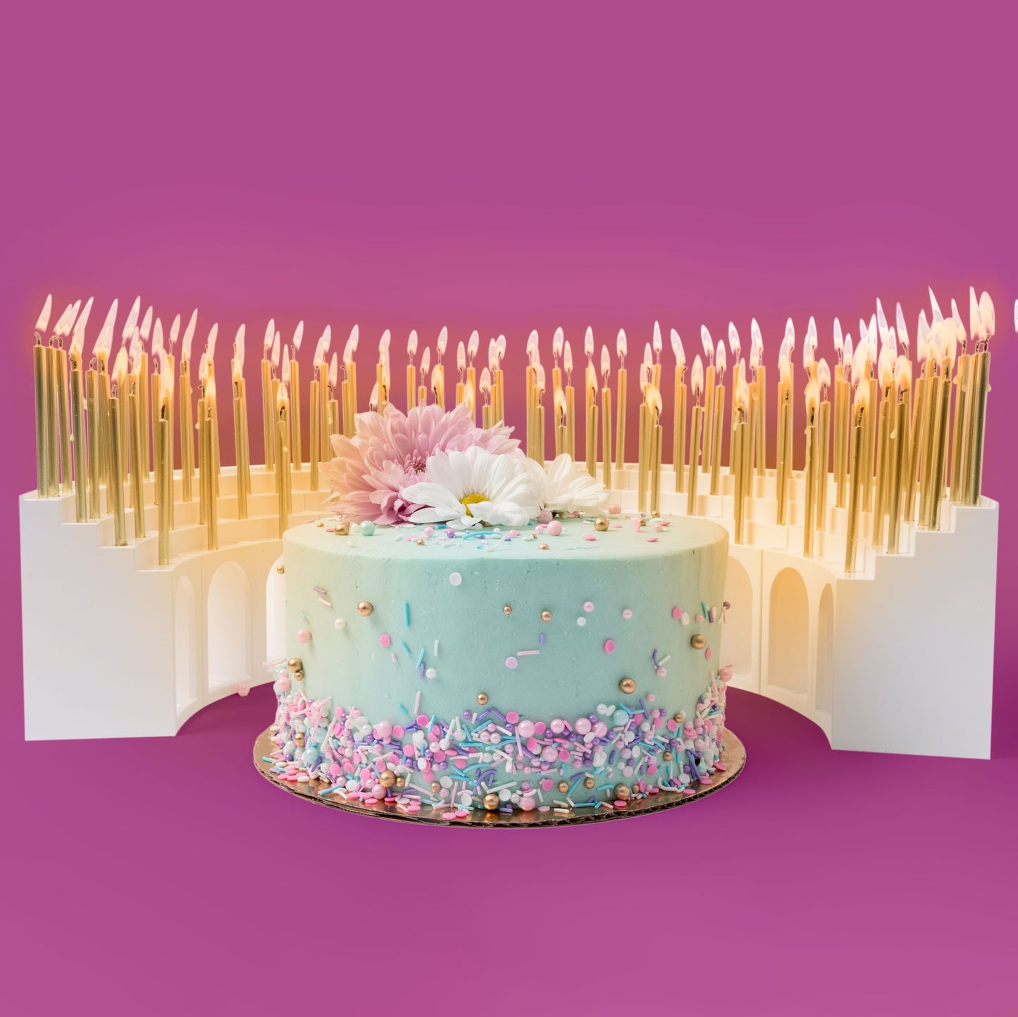 Grandstands birthday candle holder with 100 candles and festive birthday cake