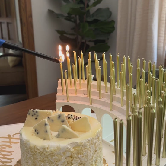 Carrying in a birthday cake with 70 lit candles on a Grand Entrance Tray and Celebration Stadium Candle Holder, get ready to sing "Happy Birthday"!